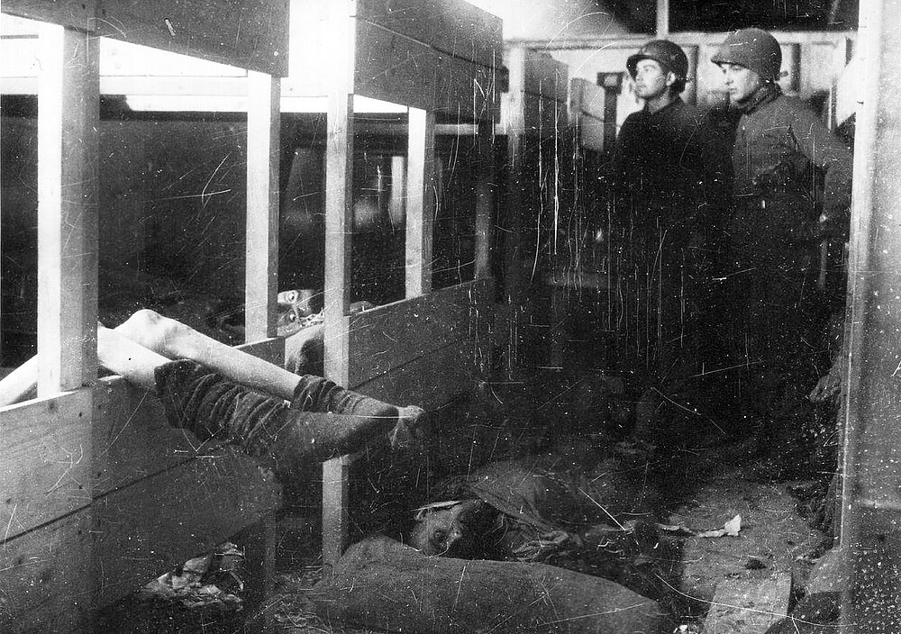 American soldiers find dead and dying concentration camp inmates in a barracks in the liberated Dora camp, April 1945.